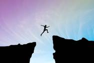 Man jumping a chasm